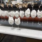 Custom engraved wine glasses for Susie Goff Invitational 2026 golf club event completed by Business Mail Boutique in Sugar Land, TX.